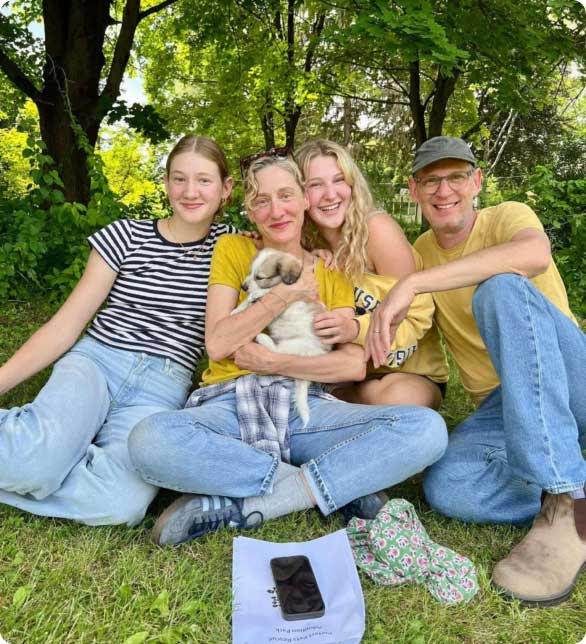 family of four with dog