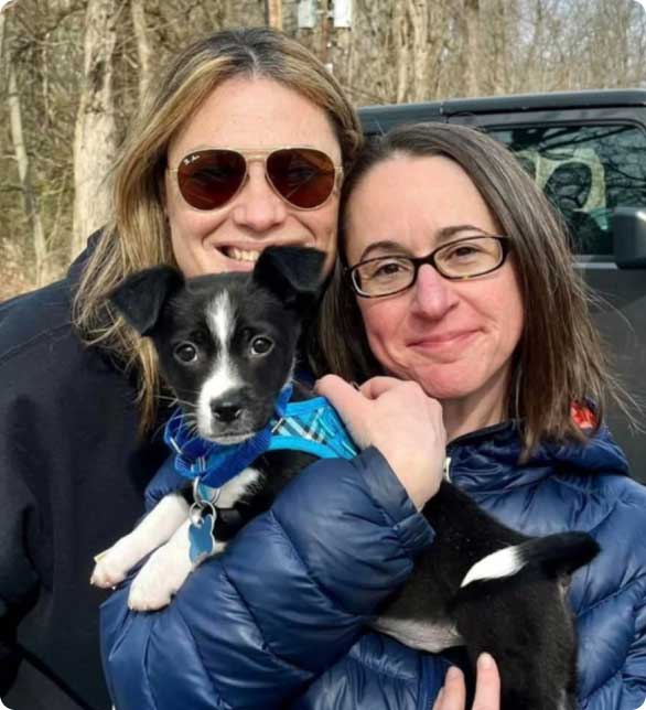 female couple with dog